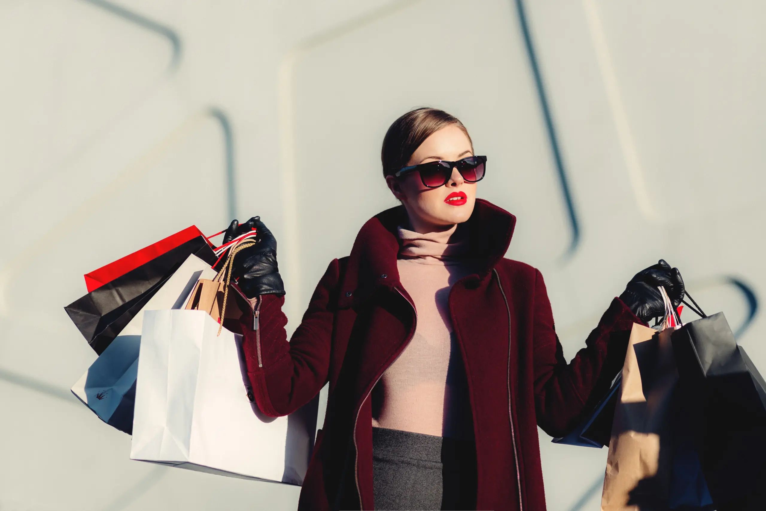 Woman holding up shopping bags